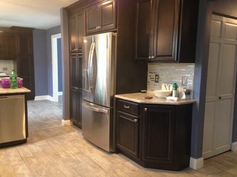 A Kitchen With Sleek Dark Wood Cabinets