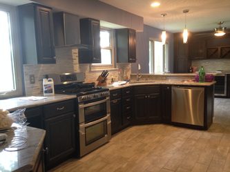 A Kitchen With Sleek Dark Cabinets