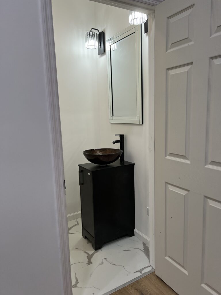 A Bathroom With a Sink and Mirror
