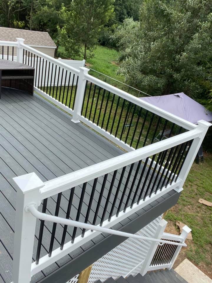 A Deck With a Railing and Stairs