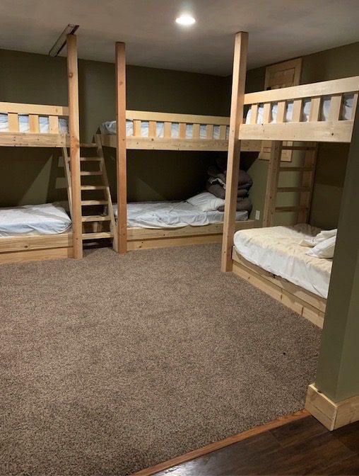 Bunk Beds in a Carpeted and Wooden-Floored Room