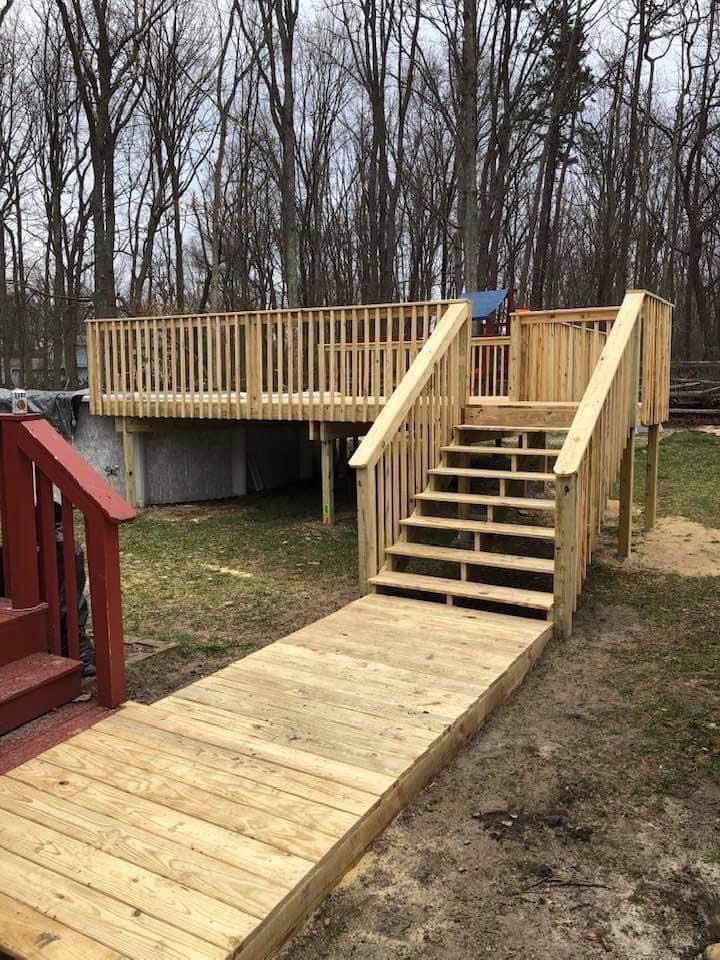 A Wooden Deck With Stairs and a Ramp
