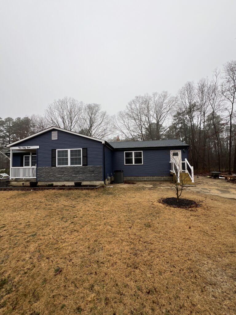 Blue House With Yard and Trees