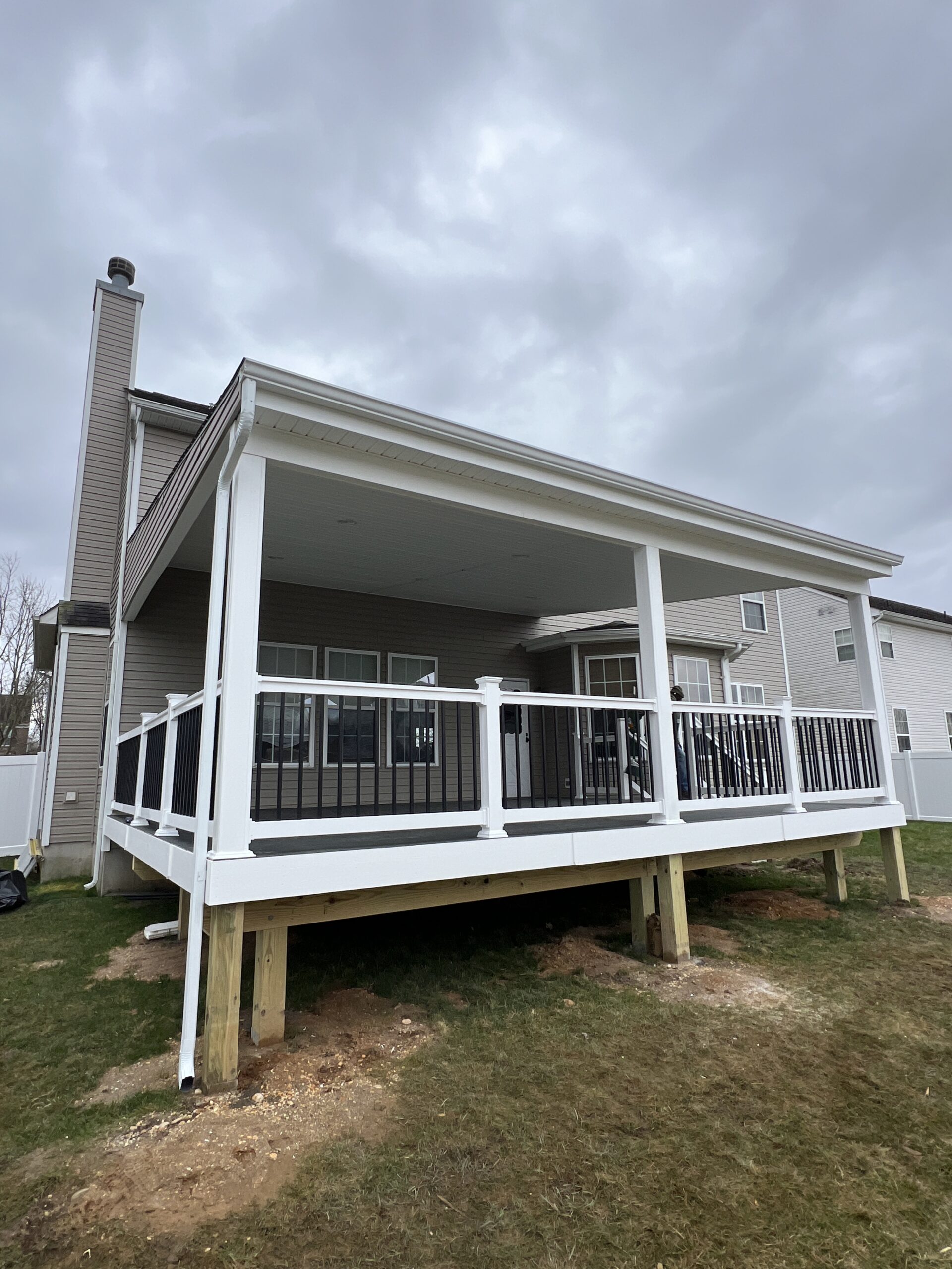 An Outdoor Porch Featuring a Deck and Railing